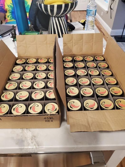 Boxes packed with jars of RedGold