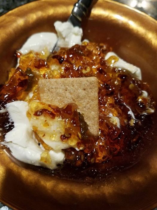 RedGold spooned over cream cheese with a cracker