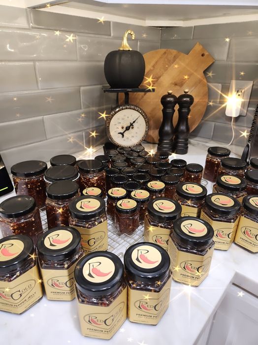 Freshly labeled RedGold jars lined up on a counter