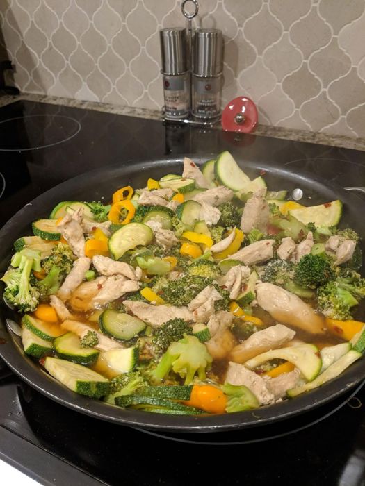 Chicken and vegetable stir-fry in a pan